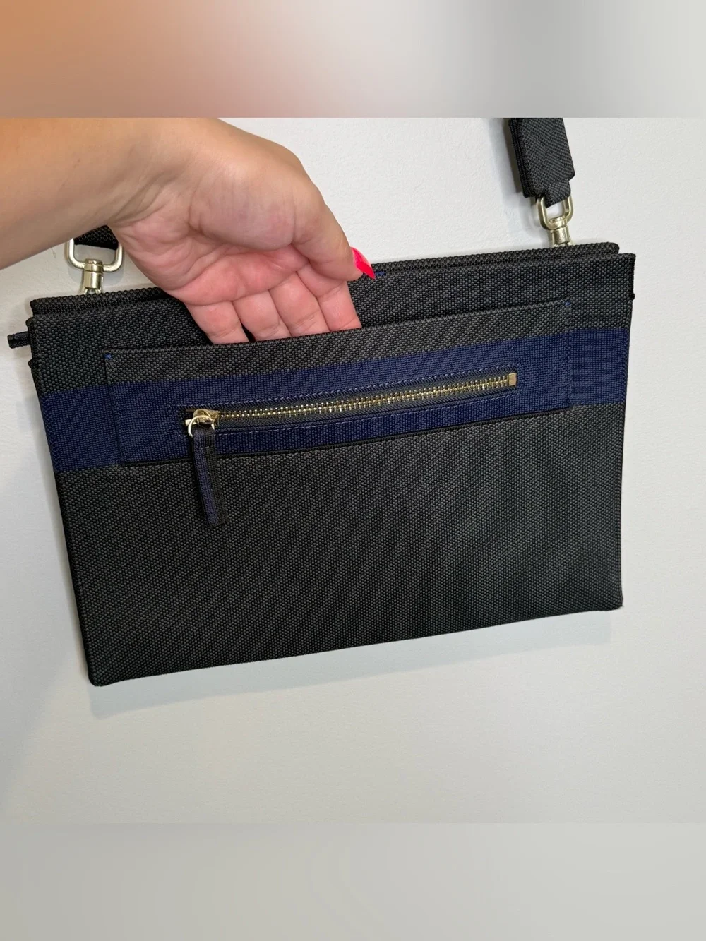 Rothy’s dark gray and blue fabric crossbody clutch or shoulder bag